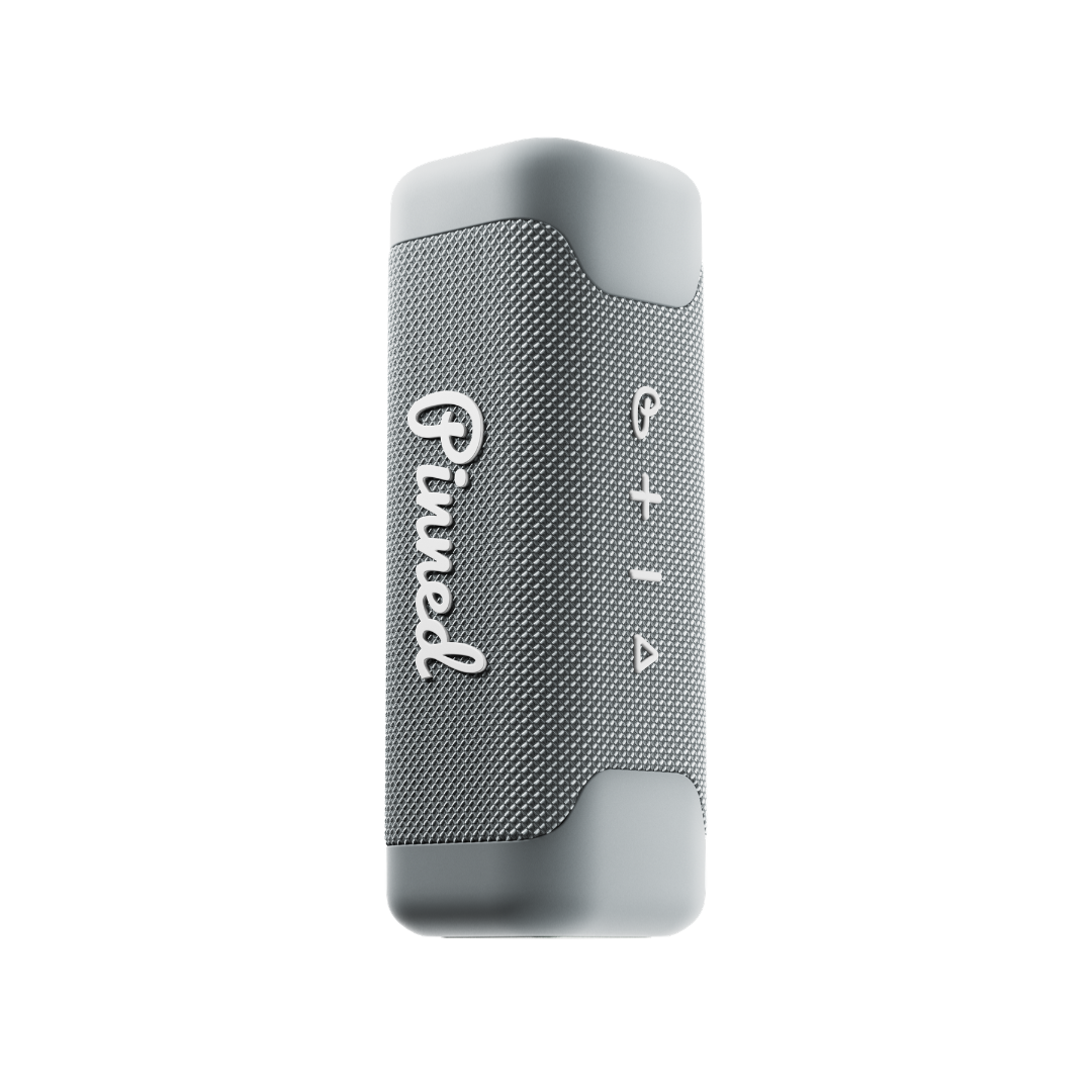 Gray portable speaker with 'Pinned' branding in white on a white background
