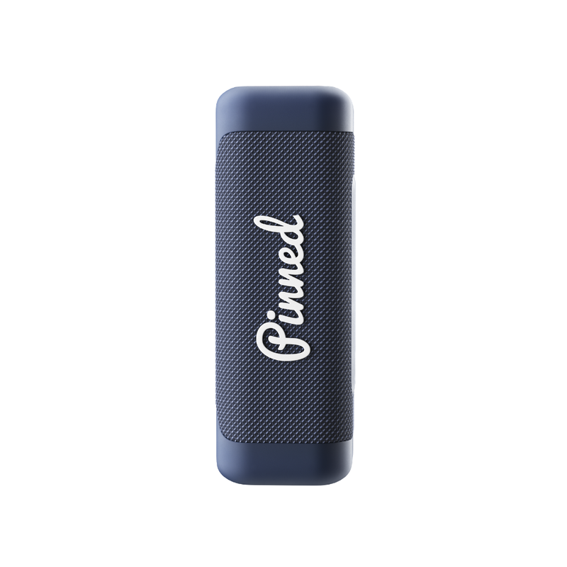 Navy blue portable speaker with 'Pinned' branding in white on a white background